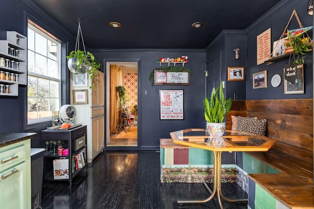 interior space with crown molding and dark wood-type flooring