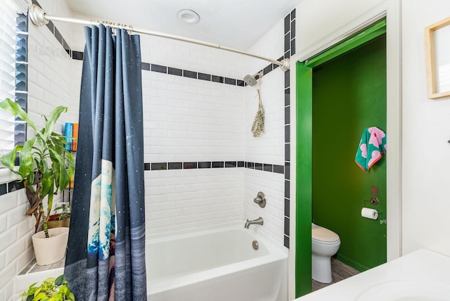 bathroom with toilet and shower / bath combo with shower curtain