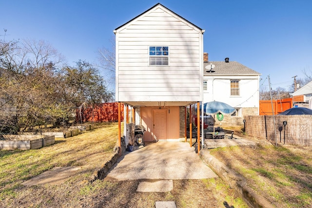 back of property with a patio