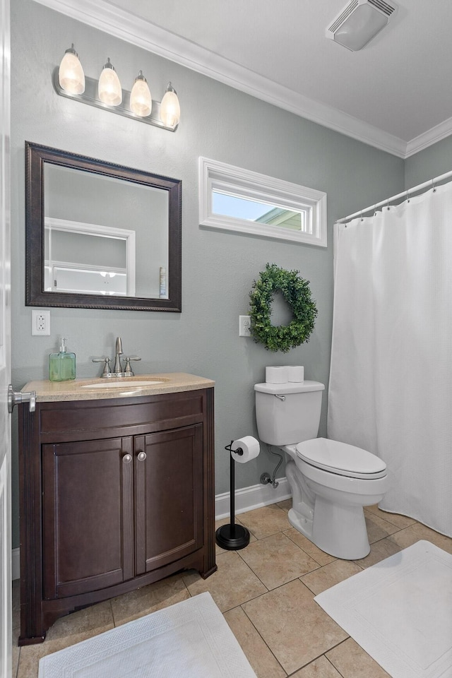 bathroom featuring tile patterned flooring, vanity, crown molding, and toilet