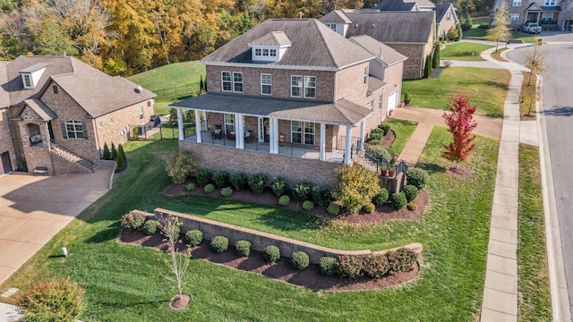 view of front facade with a front yard and a porch