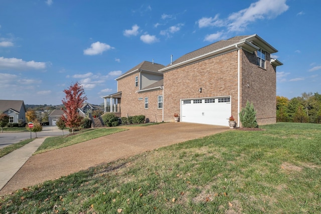 view of side of home featuring a yard and a garage