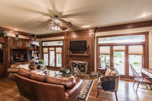 living room with french doors, a healthy amount of sunlight, and wood-type flooring