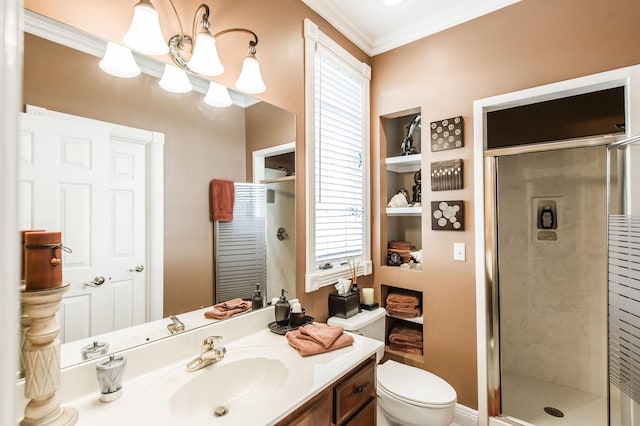 bathroom with vanity, walk in shower, a notable chandelier, toilet, and crown molding