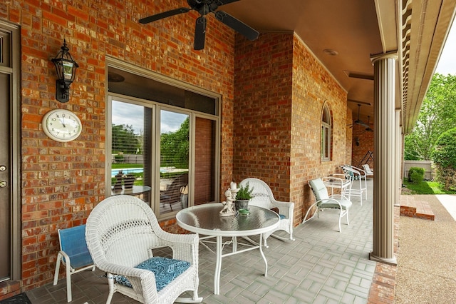 view of patio / terrace featuring ceiling fan