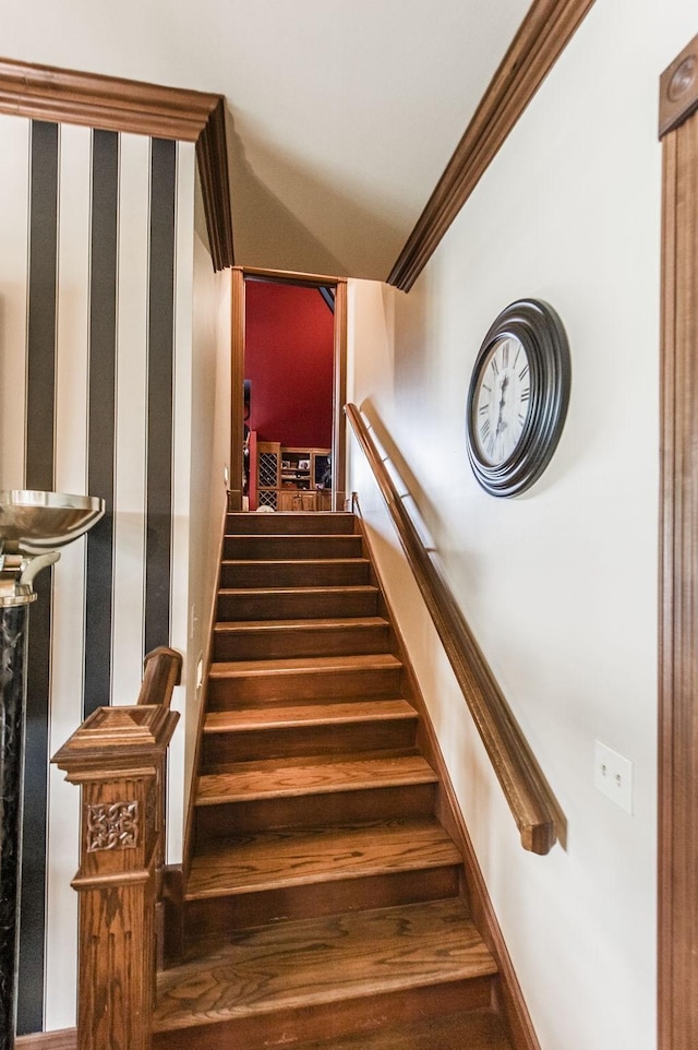 staircase with crown molding