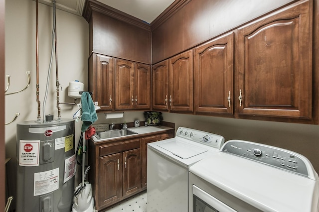 laundry area featuring cabinets, washing machine and clothes dryer, sink, and water heater