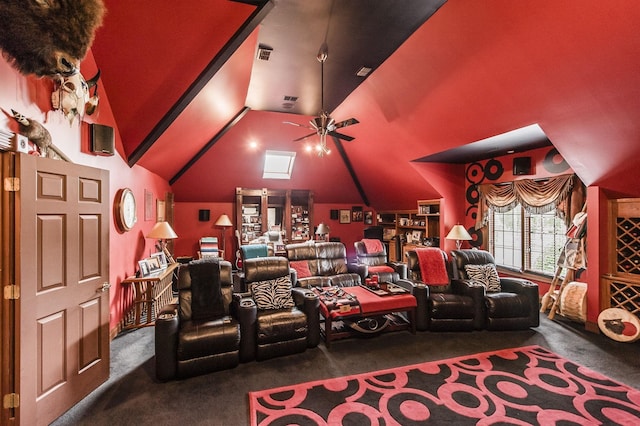 home theater room with vaulted ceiling, carpet, and ceiling fan