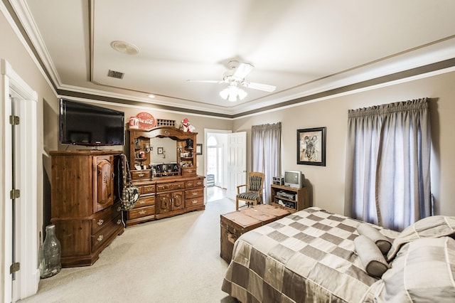 carpeted bedroom featuring crown molding and ceiling fan