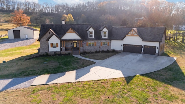 view of front of property with a garage and a front lawn