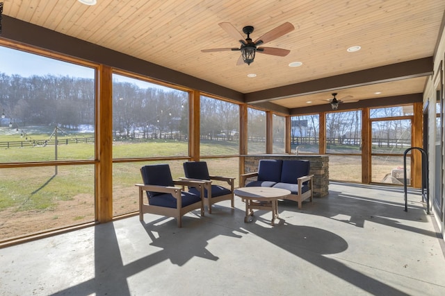 sunroom featuring wood ceiling and sink