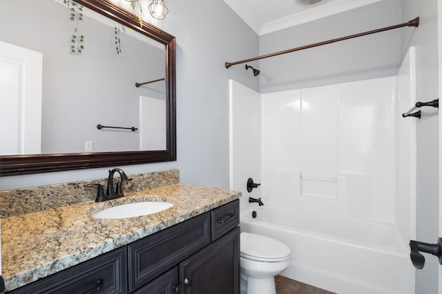 full bathroom featuring vanity, bathtub / shower combination, ornamental molding, and toilet