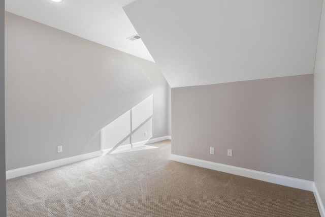 bonus room featuring lofted ceiling and carpet floors