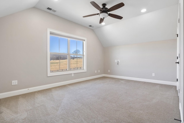 bonus room with vaulted ceiling, light carpet, and ceiling fan