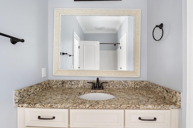 bathroom featuring vanity and crown molding