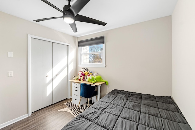 bedroom featuring ceiling fan, hardwood / wood-style floors, and a closet