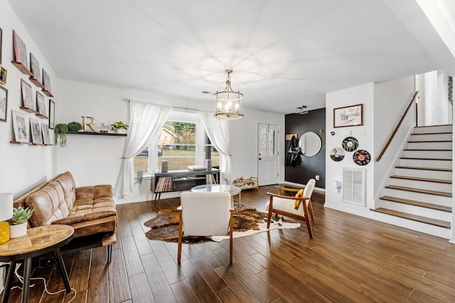 living room featuring hardwood / wood-style flooring and a notable chandelier