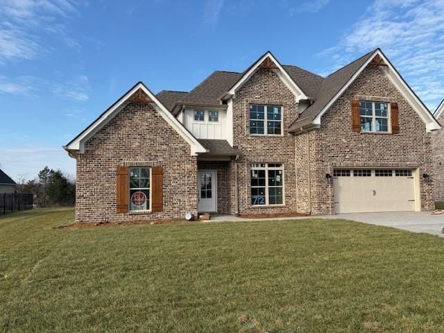 view of front facade featuring a garage and a front yard