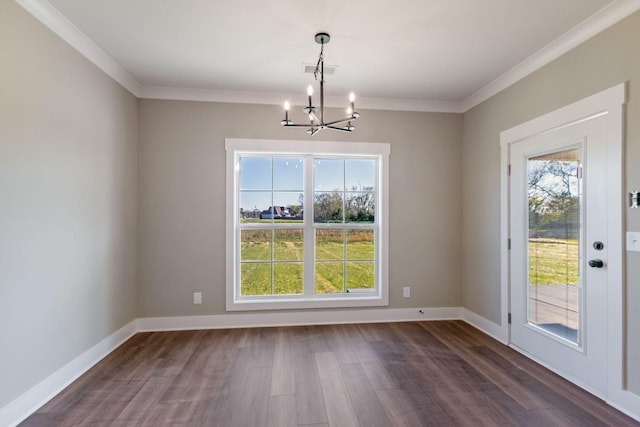unfurnished dining area with a chandelier, a healthy amount of sunlight, and dark wood-style flooring