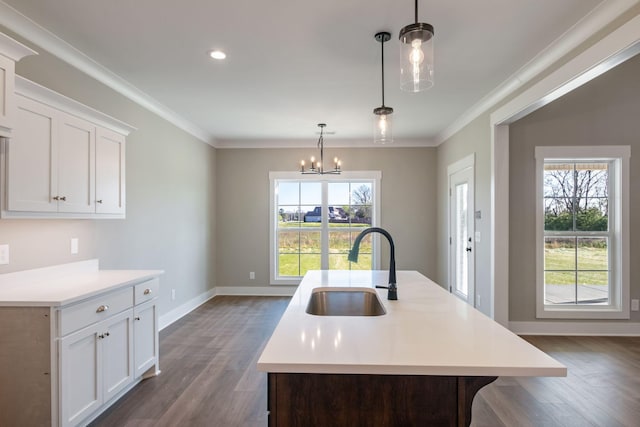 kitchen featuring dark wood-style floors, light countertops, and a sink