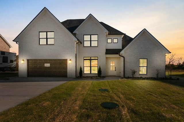 view of front of property with an attached garage, concrete driveway, and brick siding