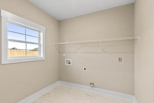 clothes washing area featuring baseboards, laundry area, electric dryer hookup, marble finish floor, and hookup for a washing machine