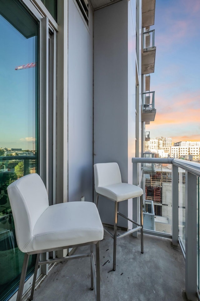 view of balcony at dusk