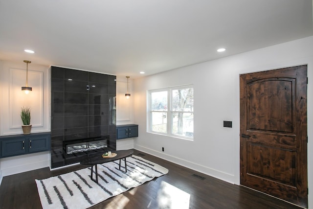 living room featuring dark wood-type flooring