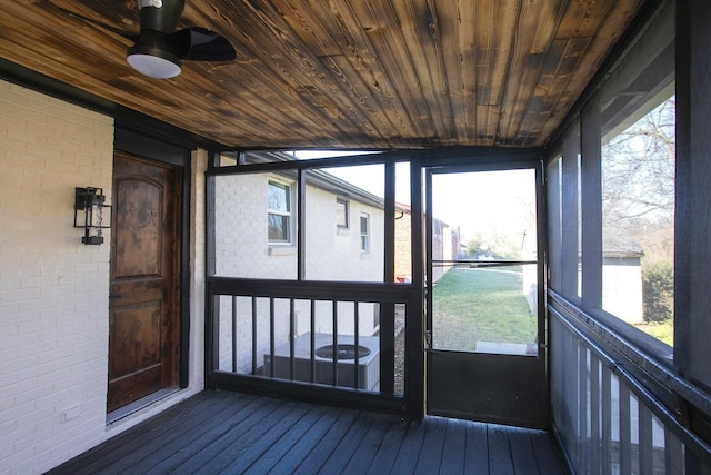 unfurnished sunroom with wooden ceiling