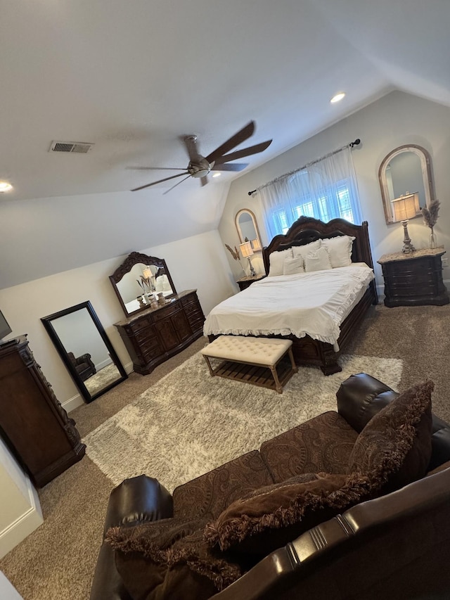 carpeted bedroom with ceiling fan and lofted ceiling