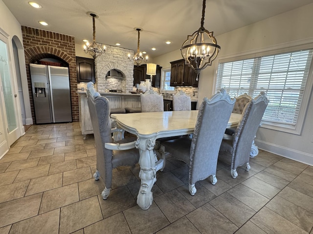 dining space featuring an inviting chandelier