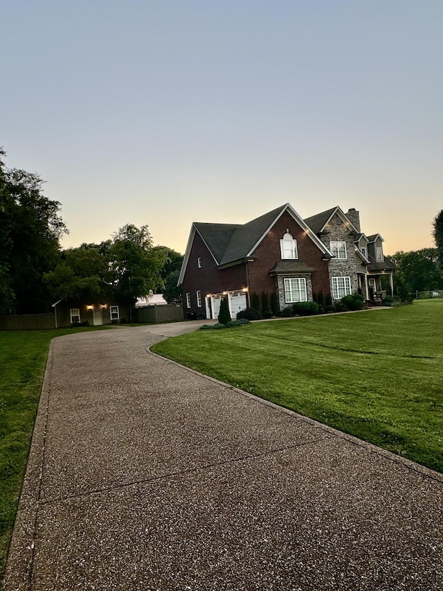 view of front of home featuring a lawn