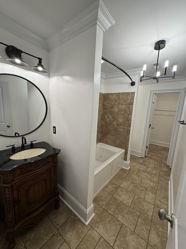 bathroom with vanity, a notable chandelier, crown molding, and tiled shower / bath combo