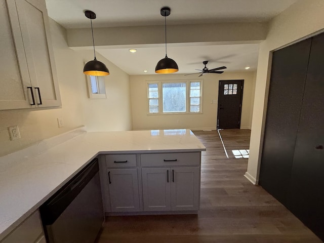 kitchen with dark wood-type flooring, light stone counters, decorative light fixtures, dishwasher, and kitchen peninsula