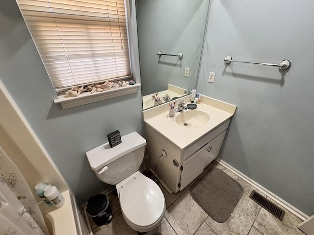 bathroom with vanity and toilet