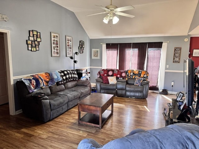 living room featuring lofted ceiling, hardwood / wood-style flooring, and ceiling fan