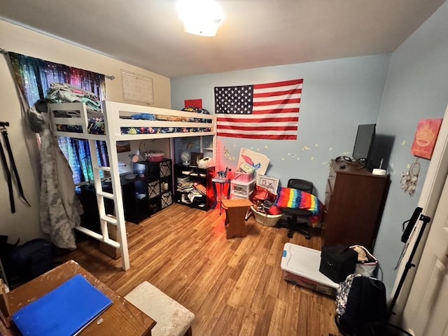 bedroom featuring wood-type flooring