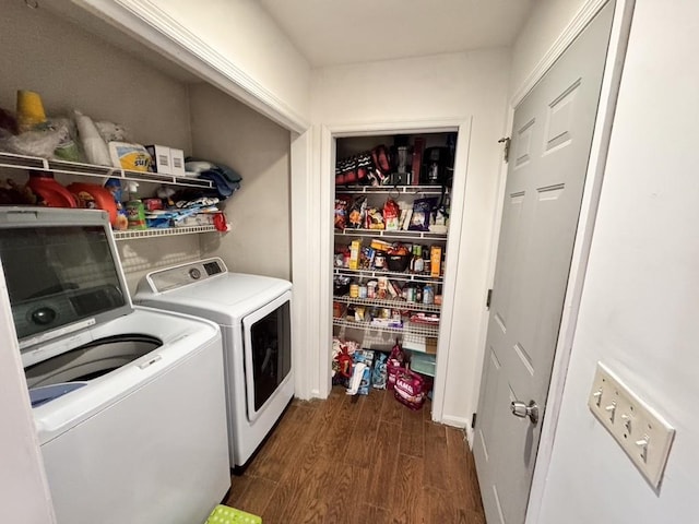 laundry room featuring dark hardwood / wood-style flooring and washer and dryer