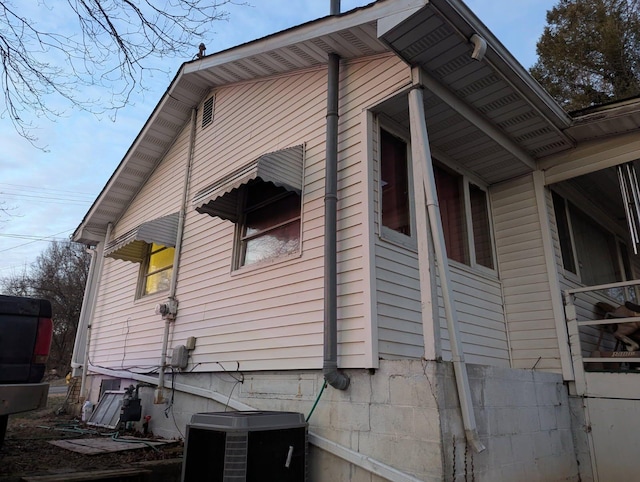 view of home's exterior with central AC unit