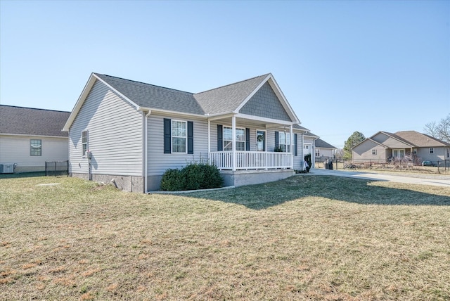 view of front of property featuring central AC, a front lawn, and covered porch