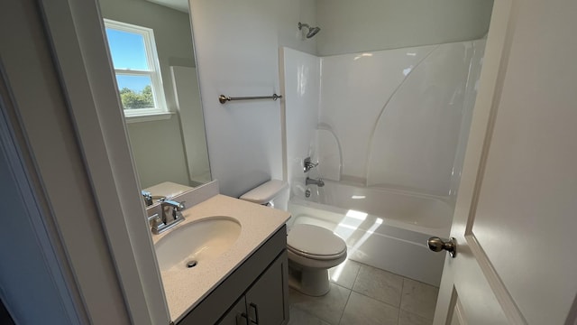 full bathroom featuring vanity, shower / washtub combination, tile patterned floors, and toilet