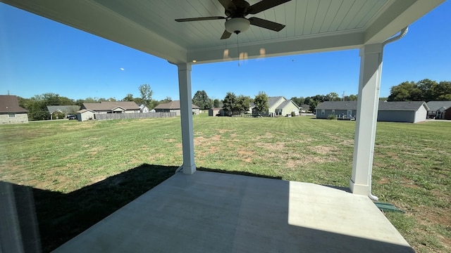 view of yard featuring a patio area and ceiling fan