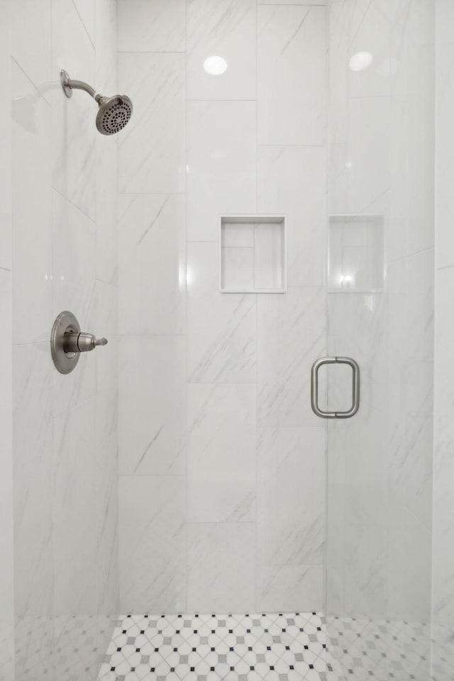 bathroom featuring an enclosed shower