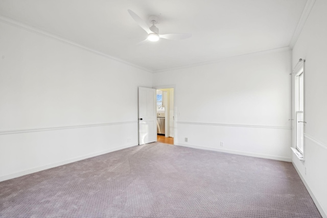 unfurnished room featuring crown molding, carpet flooring, and ceiling fan