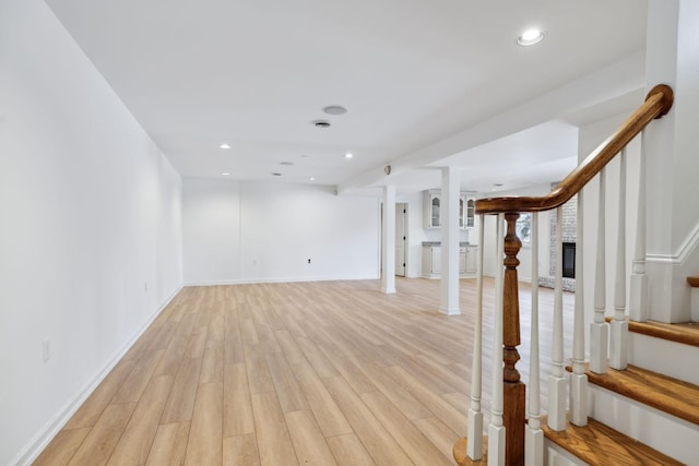 basement featuring light wood-type flooring