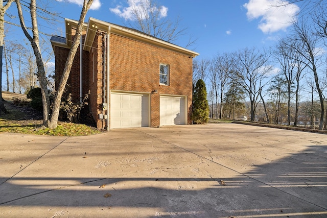 view of side of home with a garage