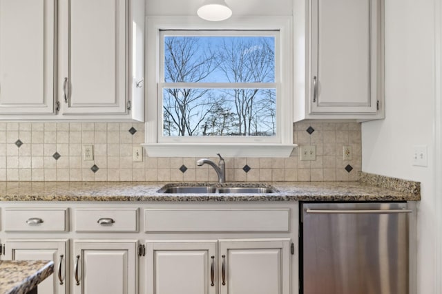 kitchen with white cabinetry, sink, and dishwasher