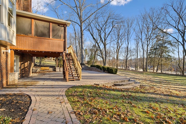 view of yard with a patio area and a sunroom