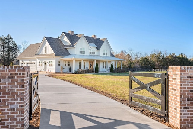 view of front of home featuring a front yard and a porch