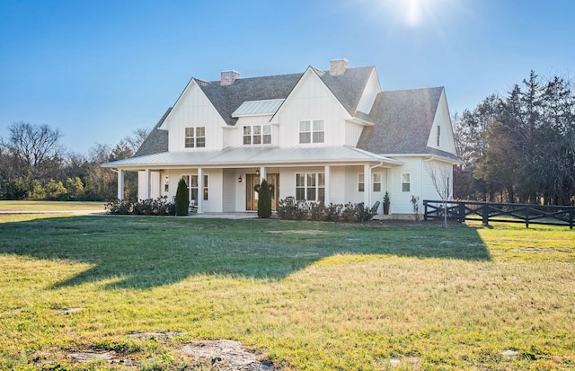 modern farmhouse featuring a front lawn and covered porch